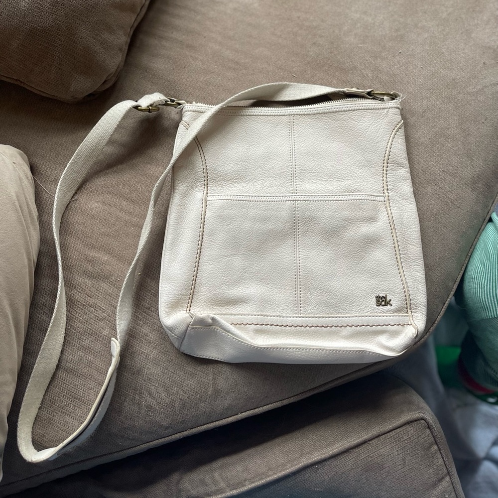 Off-white crossbody bag by The Sak!